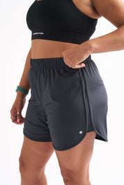 Side view of Locked In running shorts with foldable waistband and breathable fabric designed for comfort.