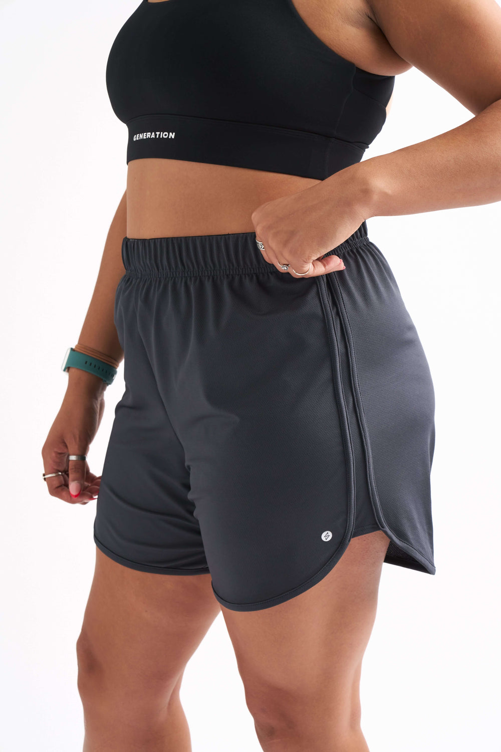 Side view of Locked In running shorts with foldable waistband and breathable fabric designed for comfort.