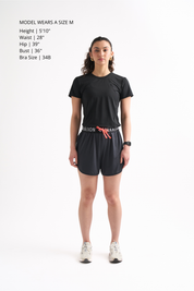 Woman wearing Locked In Running Shorts with a drawstring waist and breathable mesh fabric for ultimate comfort.